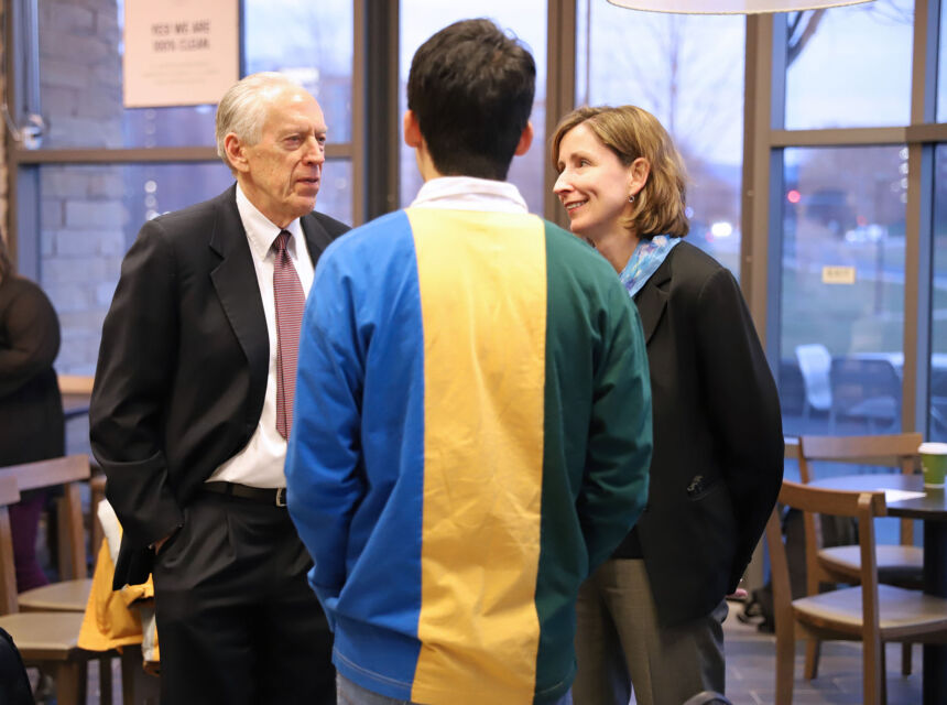 SIA professors Jett and Ransom interacting with a student