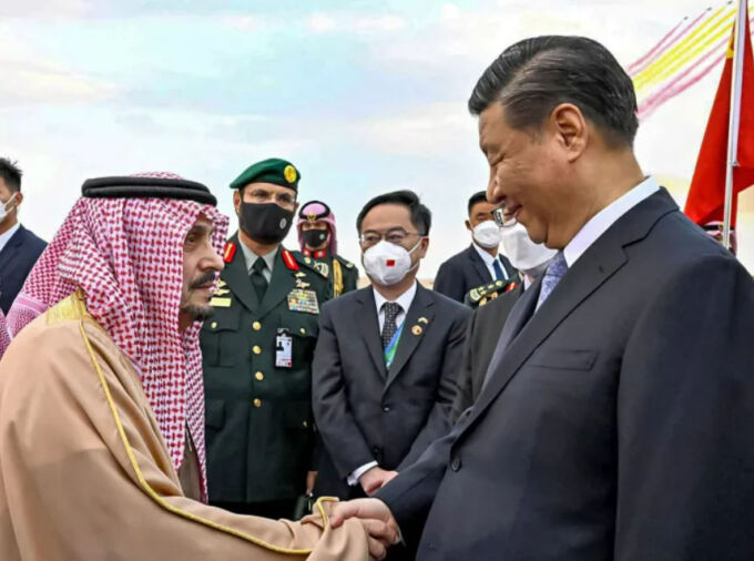 China's President Xi Jinping (R) being received by the governor of Riyadh province, Prince Faisal bin Bandar Al Saud (L), at King Khalid International Airport in Saudi Arabia's capital Riyadh on December 7, 2022